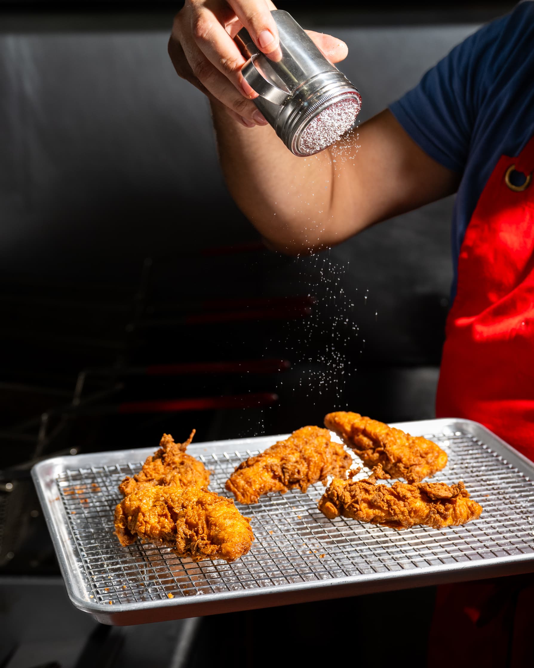 Chicken being salted