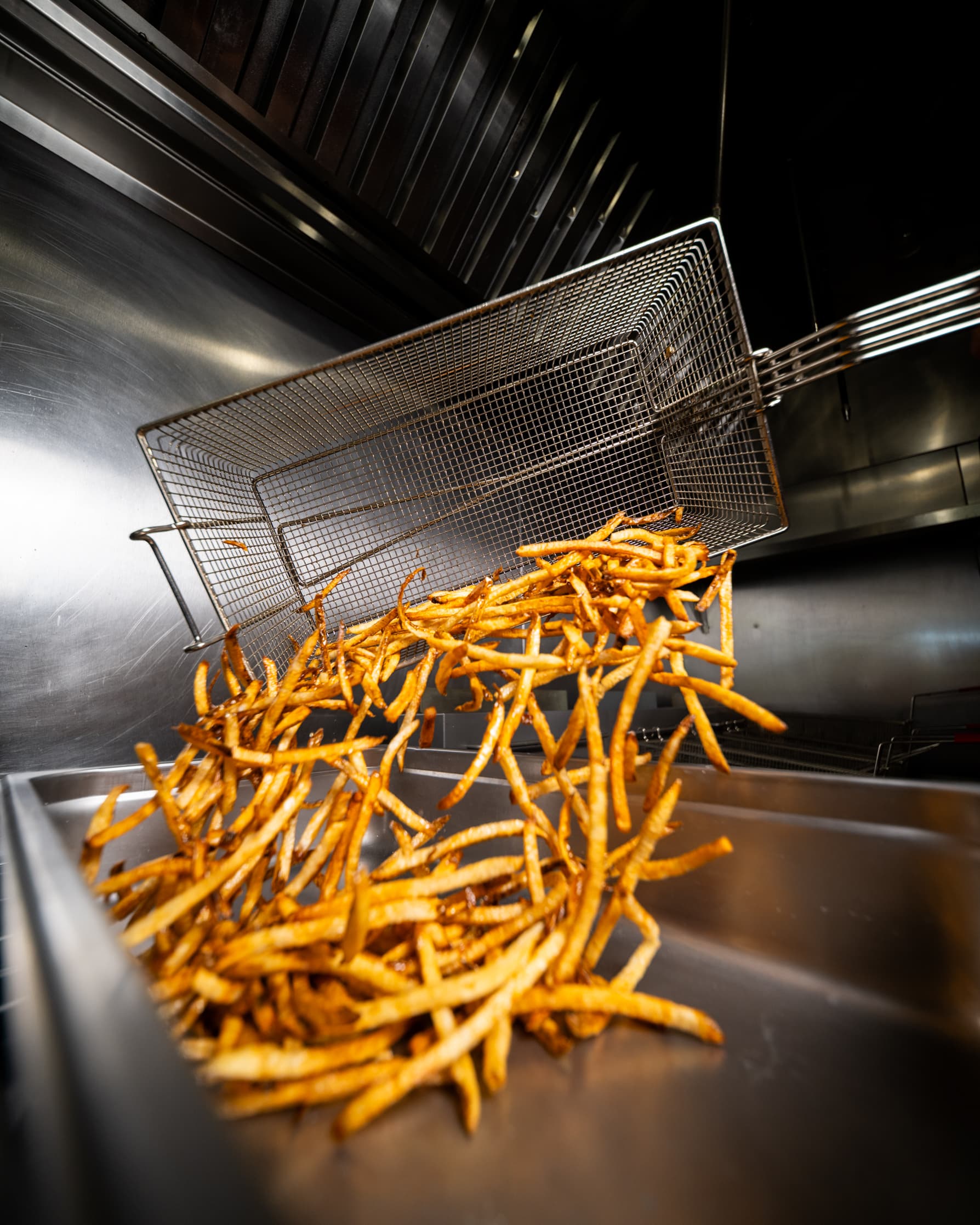 Fries getting a second fry in beef tallow for extra crunch